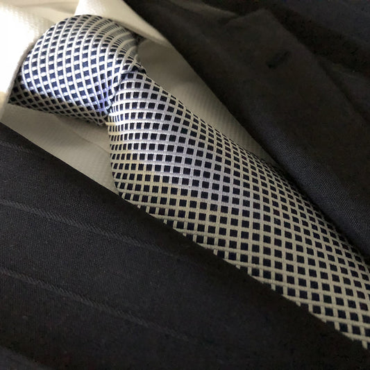 “DISTINGUISHED GENT” SEVEN FOLD SILK NECK TIE